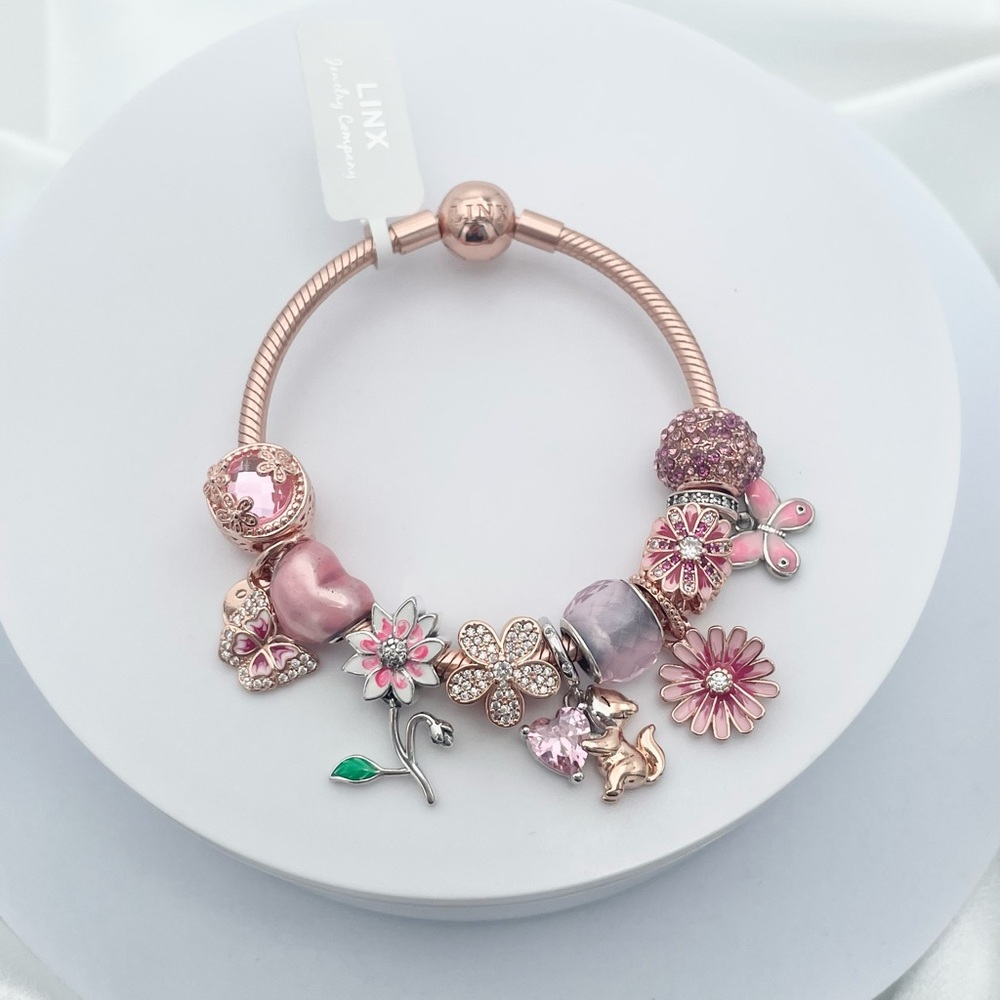 Linx Rose Gold Bracelet with Rose Gold and Pale Pink Themed Charms